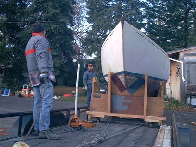 They used a chain fall to pull the cradle up onto the trailer