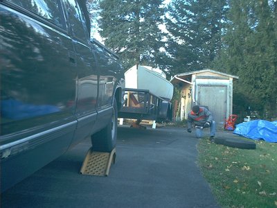 As you can see, they removed the wheels from the trailer (down to the hubs).  I think the truck is up on the ramps to improve the angle.